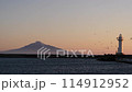 View of the sea at dusk, the lighthouse and Rishiri Island. 114912952