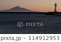 View of the sea at dusk, the lighthouse and Rishiri Island. 114912953