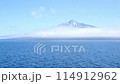 Rishiri Island appears to be floating with clouds hanging over the foot of the mountain. An island in the sky. 114912962