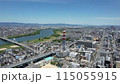 Aerial footage of Moriguchi City, Asahi Ward, and Higashiyodogawa Ward in Osaka Prefecture overlooking the Yodo River 115055915