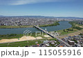 Aerial footage of Moriguchi City, Asahi Ward, and Higashiyodogawa Ward in Osaka Prefecture overlooking the Yodo River 115055916