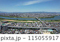 Aerial footage of Moriguchi City, Asahi Ward, and Higashiyodogawa Ward in Osaka Prefecture overlooking the Yodo River 115055917