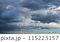 Rain clouds growing across the blue sky 115223157
