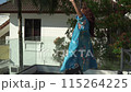 Asian woman dancing happily and enjoying a sunny day on the own terrace at morning 115264225