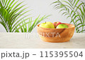 Vibrant apples and ornamental plants 115395504