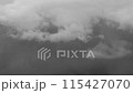 Clouds floating in the sky during unstable weather, monochrome 115427070