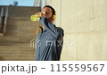 Runner man drinking water from a sports bottle outdoors. 115559567