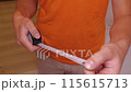 Male hands Roulette Meter Measure 115615713