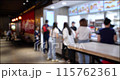 People Walking and Ordering from a Fast Food restaurant. Blurred background 4K video. 115762361