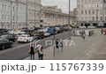 Time Lapse video of city traffic with cars, pedestrians against a backdrop of urban buildings. 115767339