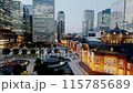 Tokyo twilight lit up skyscrapers surrounding Tokyo Station time lapse zoom out 115785689