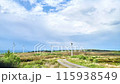 Wind turbines under storm clouds time lapse 115938549