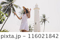 Woman Taking Selfie with Smartphone at Galle Fort Lighthouse in Sri Lanka 116021842