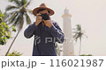 Man with Camera Photographing Galle Fort Lighthouse in Sri Lanka 116021987