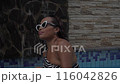 Retreat and vacation. Beautiful woman in sunglasses relaxing in spa private swimming pool outdoor 116042826