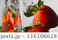 Group Juicy strawberries gently fall into clear water 116106628