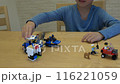 boy playing crazy with Lego 116221059
