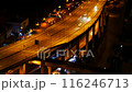 Blurred background night city bokeh car drive on road in nightlife. Light line traffic jam in black night. Blur street flare traffic motion movement. Cityscape Urban dark background twilight time 116246713