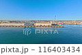 Time-lapse video of the port of Civitavecchia during the departure of a cruise ship at sunset 116403434