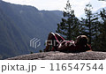 Hiking woman hiker relaxing enjoying sun in amazing nature landscape on famous Squamish Stawamus Chief Mountain Hike in British Columbia, Canada. Popular outdoor activity destination in Canada. 116547544