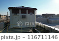 A rusted metal bridge with graffiti on it 116711146