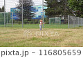 The little girl is freaking out, hysterical, walking and crying and waving her arms. 116805659