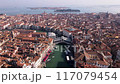 A Stunning Aerial View of Venice Featuring Iconic Rooftops and the Grand Canal Below 117079454
