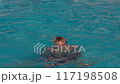 Teenager diving into pool, enjoying fun summer day sports and recreation concept 117198508