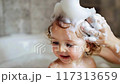Portrait of a kid washing hair in the tub 117313659