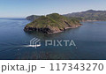 Aerial view of Tsutsuzaki in Tsushima with boats racing by 117343270