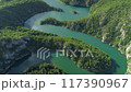 aerial view of a picturesque river meandering among the hills 117390967