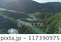 aerial view of a picturesque river meandering among the hills 117390975