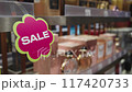 SALE sign background. Sale sign on shelf in supermarket, business concept, selective focus. 117420733