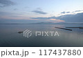 Noto Peninsula, Ishikawa Prefecture: A fishing boat sails through the calm waves of Noto Bay at dawn 117437880