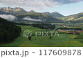 A stunning and scenic mountain landscape showcasing lush, beautiful green fields and serene nature 117609878