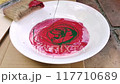 A video of dropping two colors of paint onto a plate and mixing them (starting with mixing) 117710689