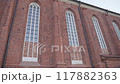 Old building with large white windows 117882363