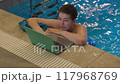 Woman Checking Laptop While in Swimming Pool 117968769