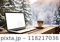 Laptop and Coffee Cup on Wooden Table in Snowy Winter Forest. Seamless looping 4K video animation 118217036