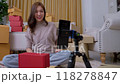 A young Asian businesswoman using a camera live streaming online and chat with customer. Business online influencer on social media concept, Online Selling, Online Shopping market. Selling at home. 118278847