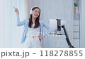 Asian women and beautiful bloggers wear headphones dancing videos by smartphone cameras. Creator vlogger talent dancing enjoys hobby content recording show video sharing on social media. 118278855