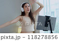 Asian women and beautiful bloggers wear headphones dancing videos by smartphone cameras. Creator vlogger talent dancing enjoys hobby content recording show video sharing on social media. 118278856