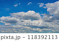 Cumulus clouds floating in the blue sky Late summer sky 118392113