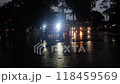 Crowded of people wear raincoats traffic on vehicle as motorbikes,cars moving on street in rainy  night, tropical depression make rain on Ho chi Minh city, Vietnam at rush hour 118459569