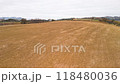 Flyover of red farmland. Aerial flight. 118480036