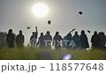 Group of graduates throwing graduation hats in the air 118577648