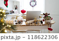 Cozy kitchen decorated for Christmas with laptop on table 118622306