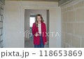 Shocked woman reading bad news on smartphone in unfinished apartment. 118653869