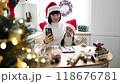 Mother and daughter taking selfie during Christmas holiday 118676781