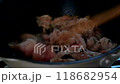 Fry meat in a frying pan. Stir-fry dishes. 118682954